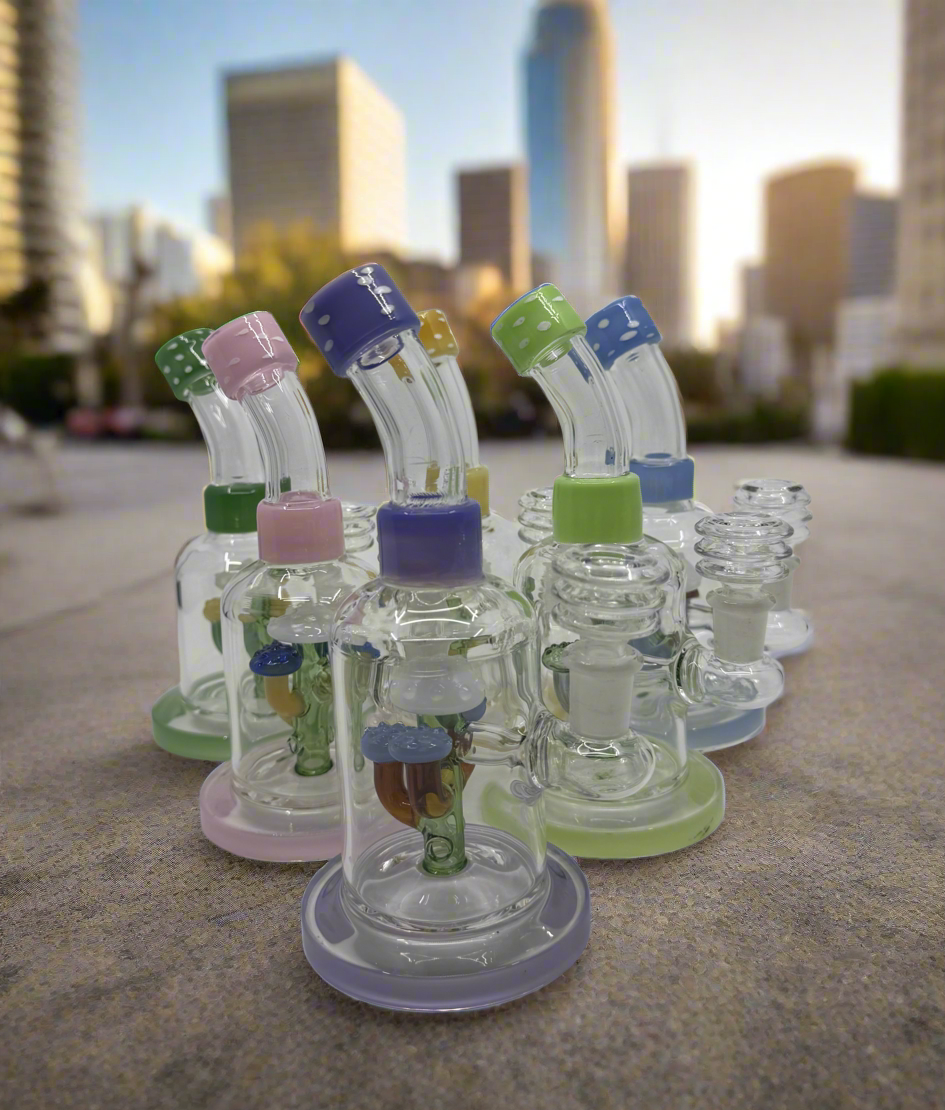 Colorful glass bongs from RK Quality Glass displayed outdoors, perfect for wholsell smokeshop at rkqualityglass.com
