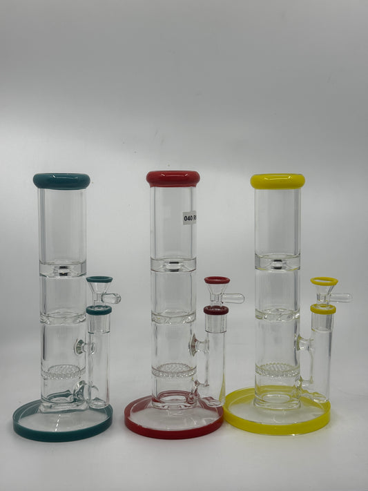 Set of clear glass water pipes with colored bowls on a white background