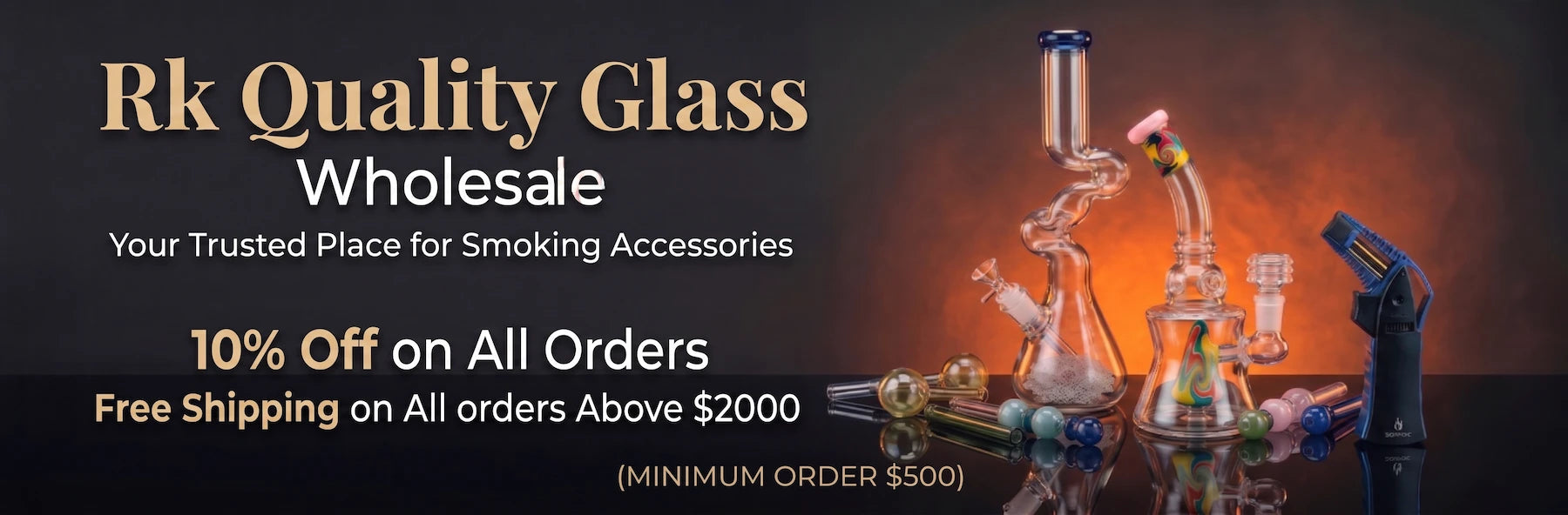 Promotional banner for 'Rk Quality Glass Wholesale' featuring various glass water pipes and smoking accessories on a reflective black surface against a warm orange and black background. The text advertises wholesale pricing, a 10% discount on all orders, and free shipping for orders above $2000.