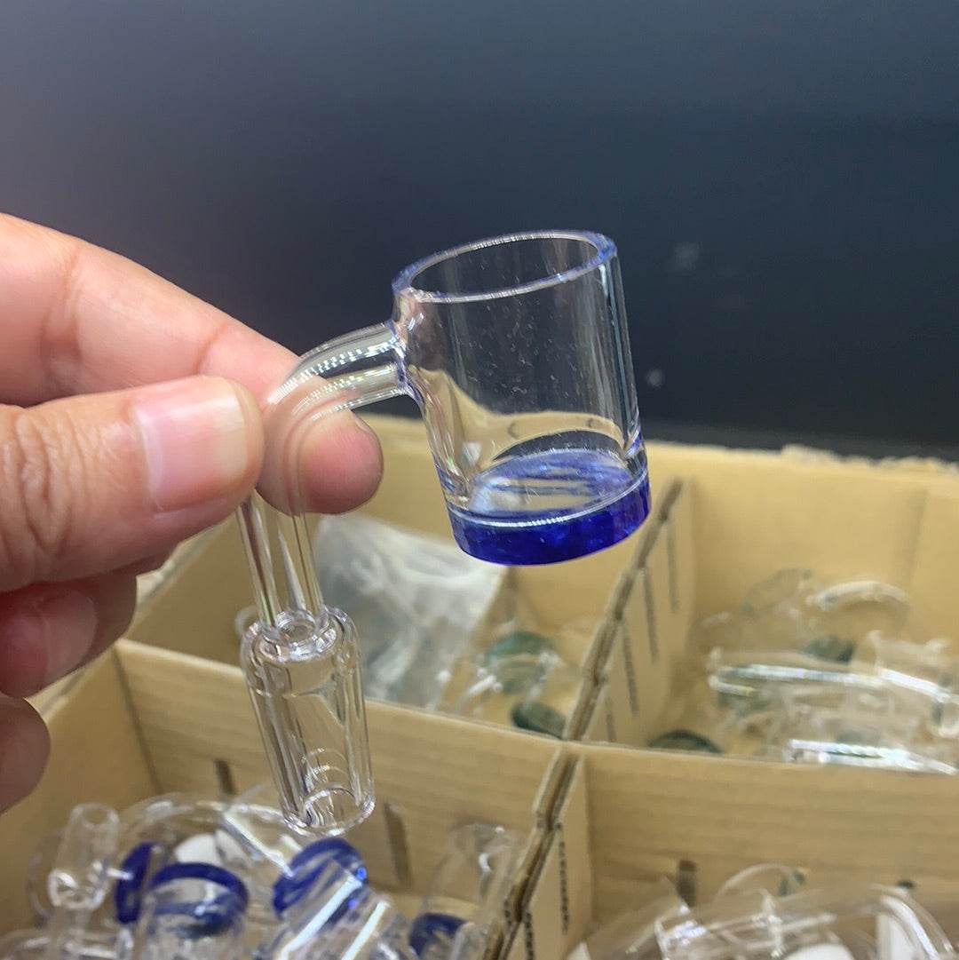 Hand holding a 14mm quartz banger for dab rigs, showcasing its clear glass design and sturdy construction